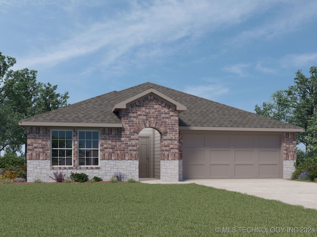 view of front of property with a front yard and a garage