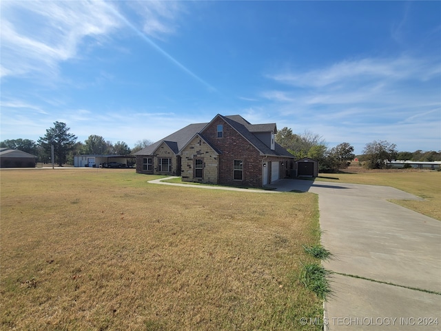 view of front of property with a front lawn and a garage