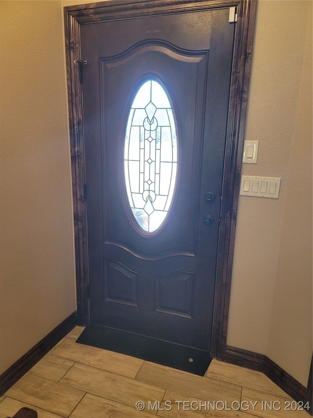 foyer entrance featuring wood-type flooring