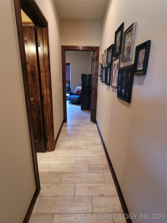 hallway with light wood-type flooring