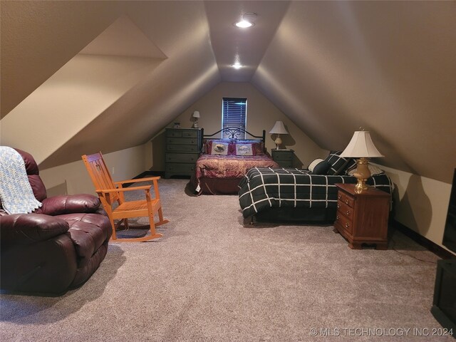 carpeted bedroom featuring vaulted ceiling