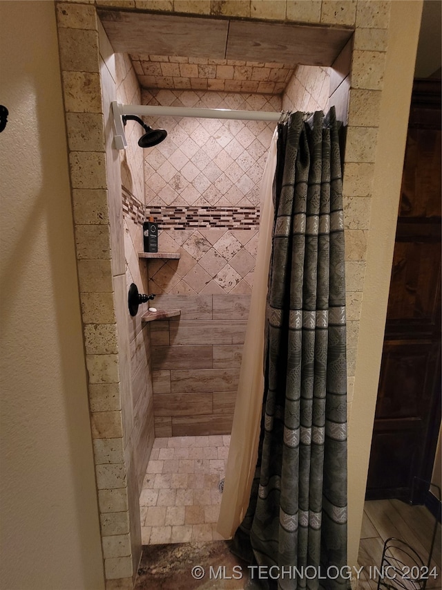 bathroom with a shower with shower curtain