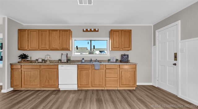 kitchen featuring ornamental molding, dishwasher, sink, and dark hardwood / wood-style flooring