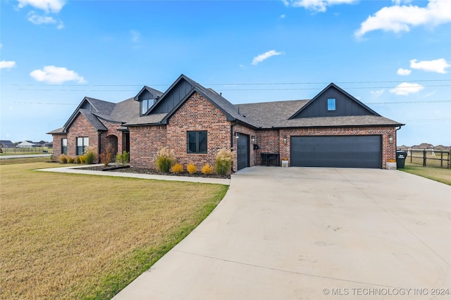 view of front of house with a front lawn and a garage