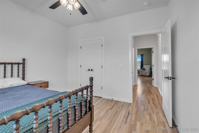 bedroom with ceiling fan and light wood-type flooring