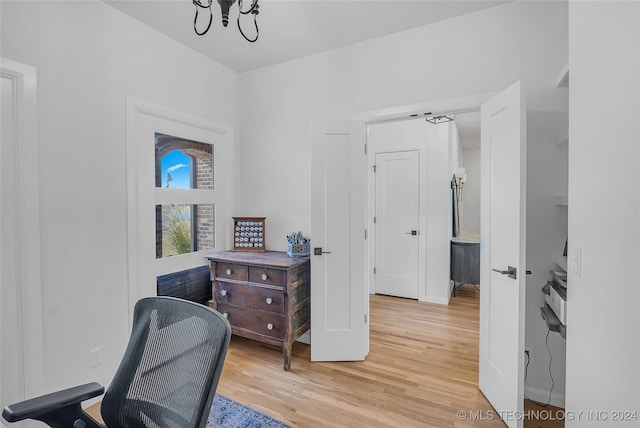 office area with a chandelier and hardwood / wood-style flooring