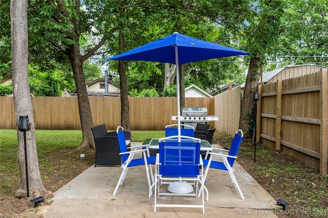 view of patio featuring a grill