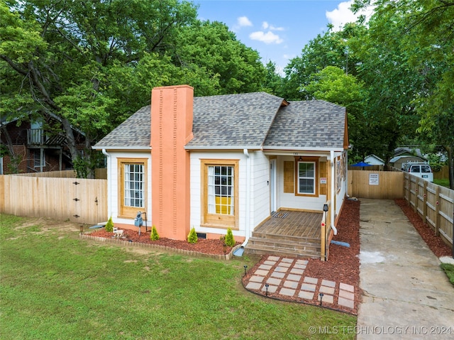 back of house with a yard