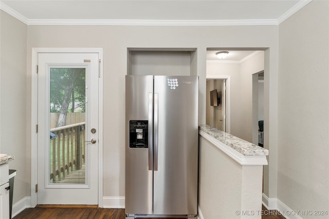 kitchen featuring ornamental molding, stainless steel fridge, light stone counters, and dark hardwood / wood-style flooring