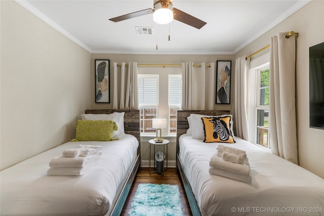 bedroom with ornamental molding, ceiling fan, and dark hardwood / wood-style flooring