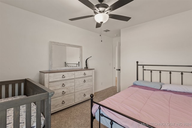 bedroom with ceiling fan and carpet flooring