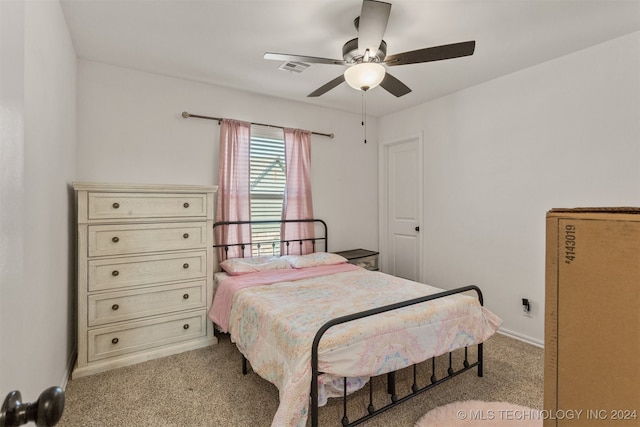 bedroom featuring light carpet and ceiling fan