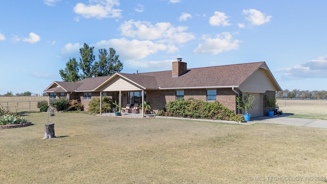 ranch-style home with a garage and a front yard