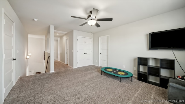 recreation room featuring carpet floors and ceiling fan