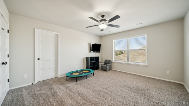 recreation room featuring carpet flooring and ceiling fan