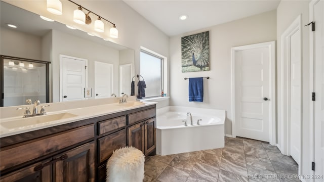 bathroom featuring vanity and plus walk in shower