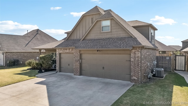 view of front of property with a garage and a front lawn