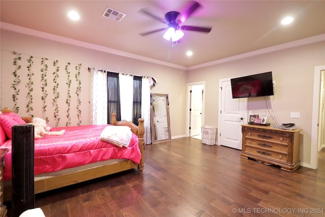 bedroom featuring dark hardwood / wood-style flooring, ornamental molding, and ceiling fan