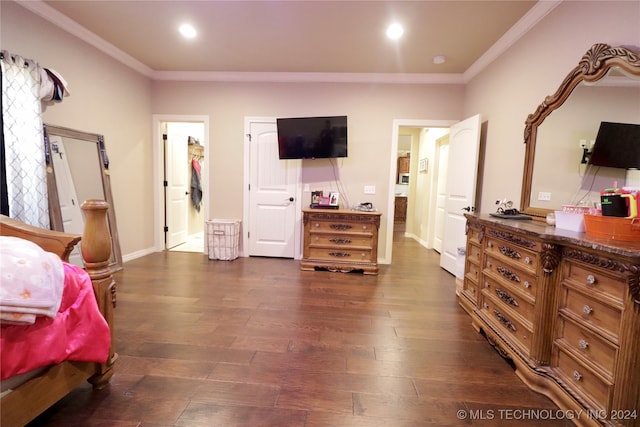 bedroom with dark hardwood / wood-style floors and crown molding