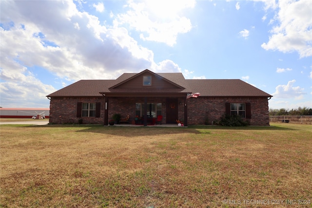 ranch-style home with a patio and a front yard