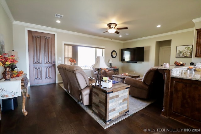 living room with dark hardwood / wood-style flooring, ceiling fan, and ornamental molding