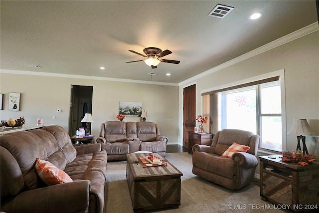 living room featuring carpet, ceiling fan, and crown molding