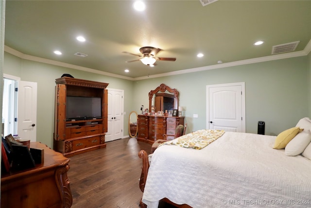 bedroom with ceiling fan, dark hardwood / wood-style floors, and crown molding