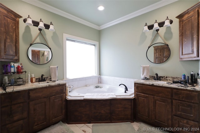 bathroom with a washtub, vanity, and crown molding