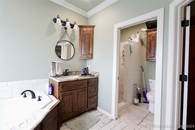 bathroom with vanity, toilet, a tile shower, and crown molding