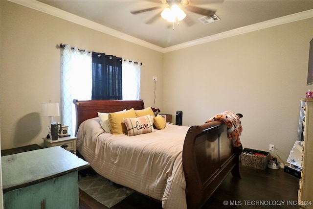 bedroom featuring ornamental molding, dark hardwood / wood-style flooring, and ceiling fan