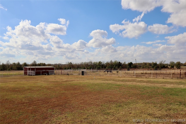 view of yard with a rural view