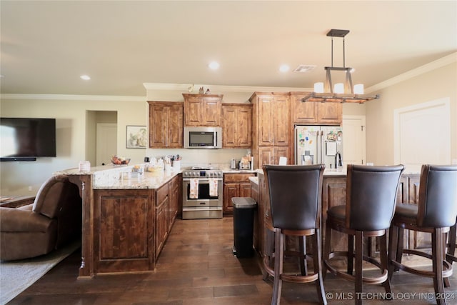 kitchen with hanging light fixtures, crown molding, dark hardwood / wood-style floors, and stainless steel appliances