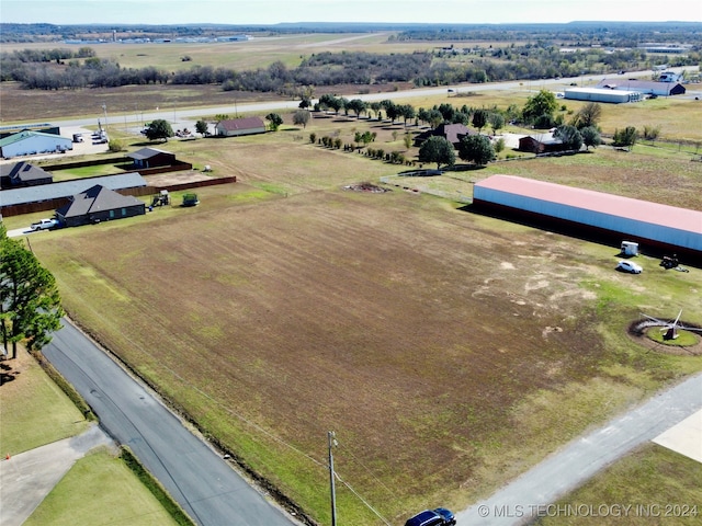 birds eye view of property featuring a rural view