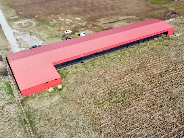 birds eye view of property with a rural view