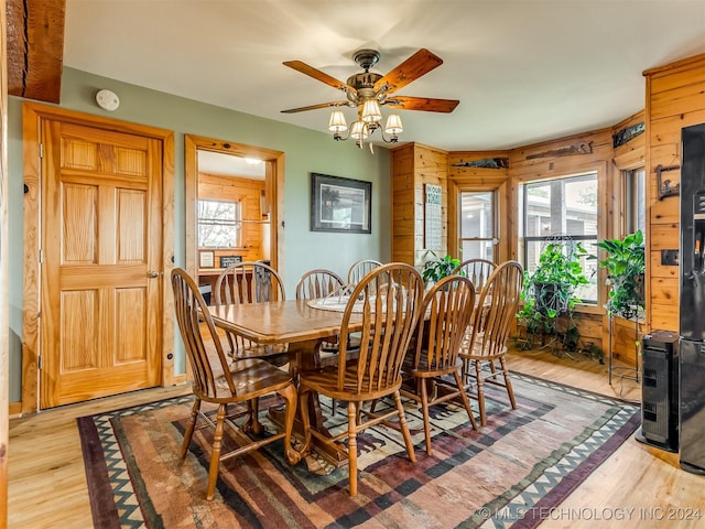 dining room featuring light wood-style floors and a ceiling fan