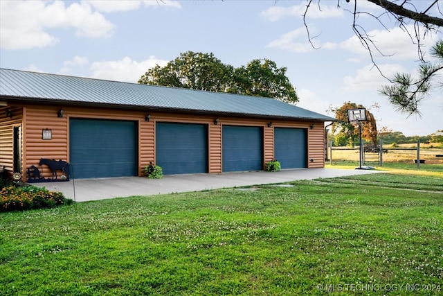 garage with a yard