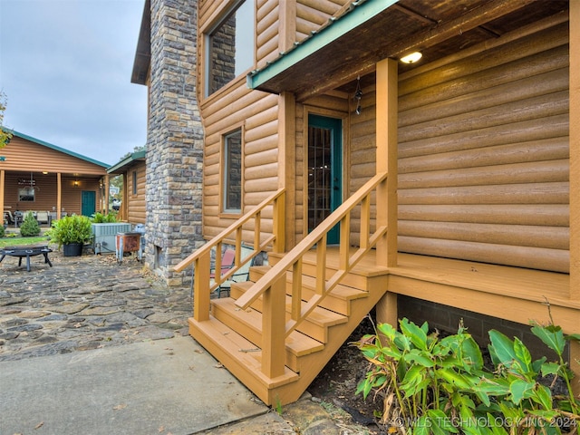 deck with entry steps and a patio area