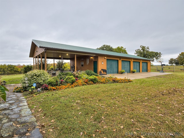 view of front of property featuring a front lawn and a garage