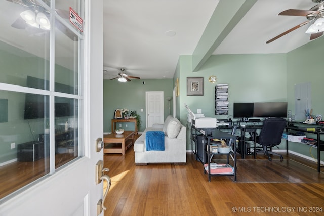 home office with ceiling fan, wood-type flooring, and electric panel