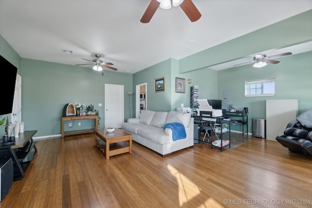 living room featuring hardwood / wood-style flooring and ceiling fan