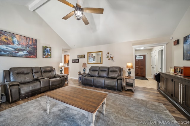 living room featuring beamed ceiling, hardwood / wood-style floors, high vaulted ceiling, and ceiling fan