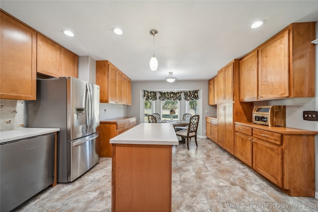 kitchen with decorative backsplash, stainless steel refrigerator with ice dispenser, hanging light fixtures, and a kitchen island