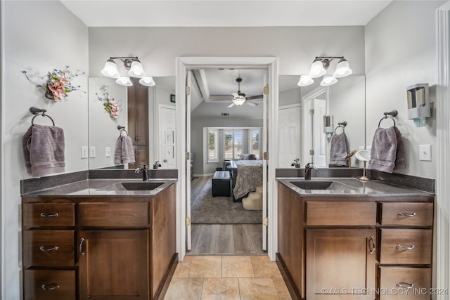 bathroom with vanity, ceiling fan, and wood-type flooring