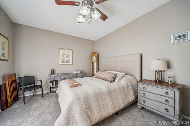 bedroom featuring vaulted ceiling, carpet flooring, and ceiling fan