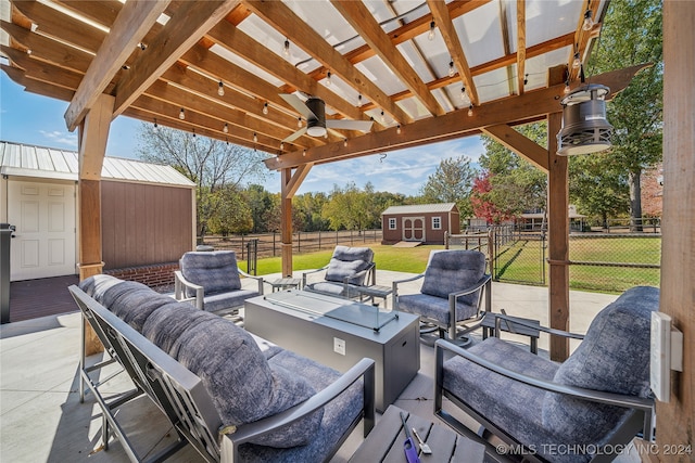 view of patio with a storage unit, ceiling fan, and an outdoor hangout area