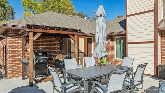 view of patio / terrace with a gazebo and a grill