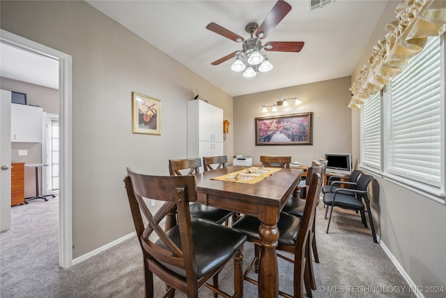 dining area with carpet flooring and ceiling fan