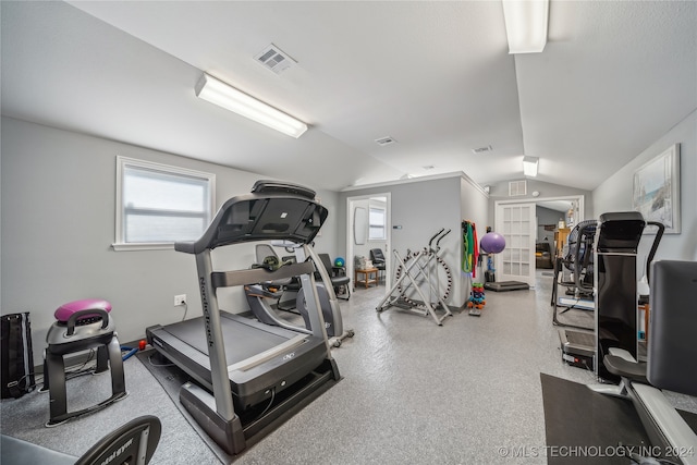 exercise area with lofted ceiling