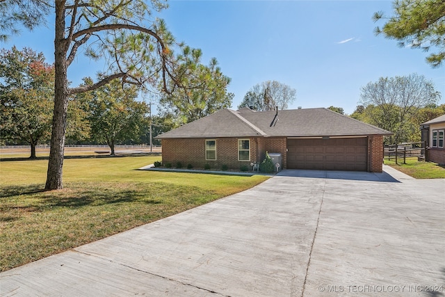 ranch-style house with a front lawn and a garage