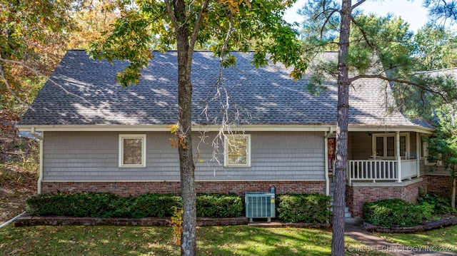 view of property exterior featuring a yard and central AC unit